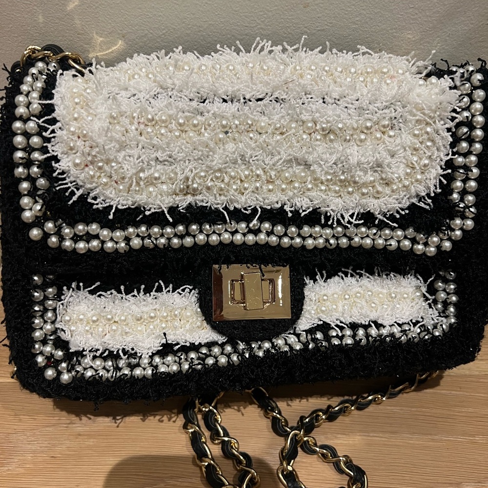Chanel style shaggy B&W purse with gold and black chain and gold closure. NWT